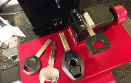 Image of four different keys in our key cutting machine, waiting for programming